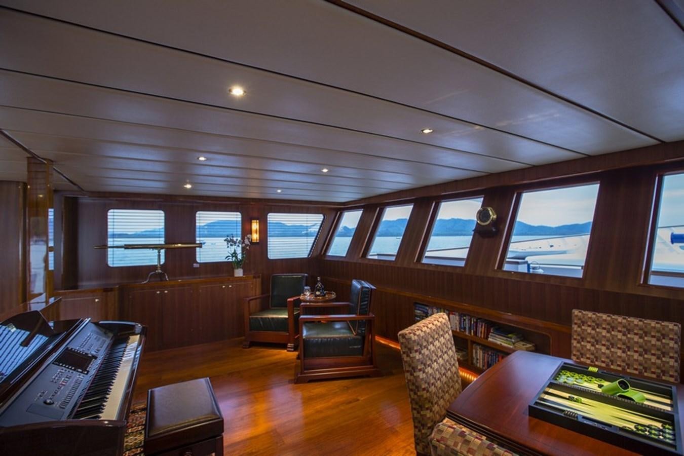 inside of a building with a piano and a piano and a piano aboard NORTHERN SUN Yacht for Sale