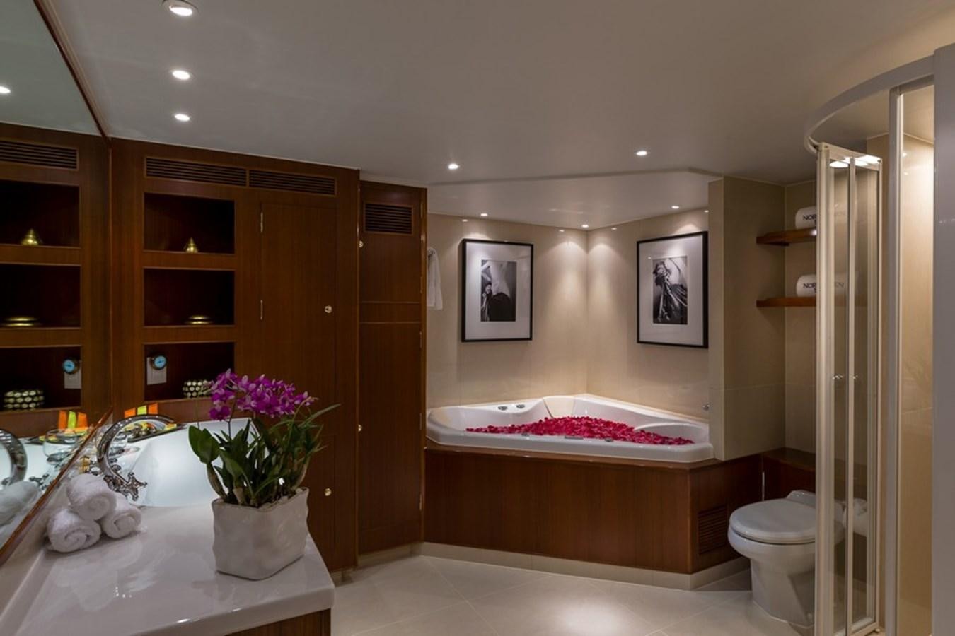 a bathroom with a tub sink and toilet aboard NORTHERN SUN Yacht for Sale
