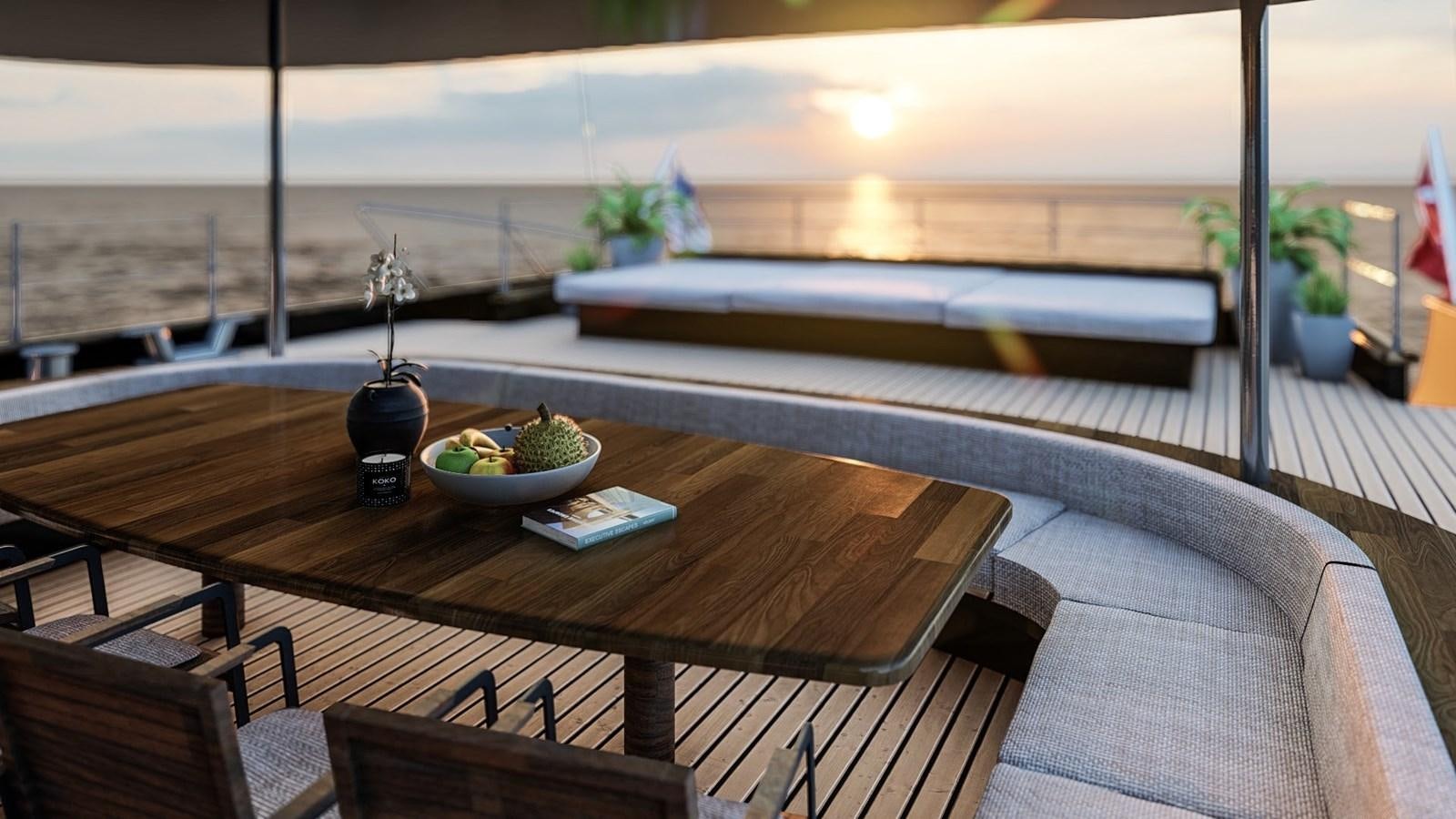 a table with a bowl of fruit on it aboard MITI K Yacht for Sale