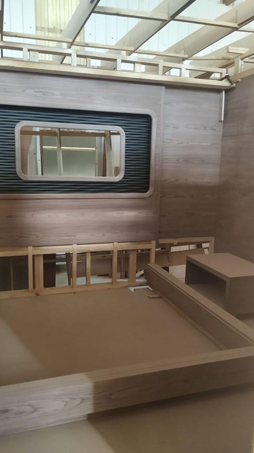 a room with a window and a bench aboard MITI K Yacht for Sale