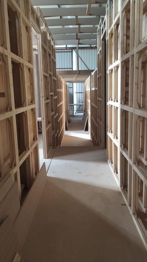 a hallway with many wooden cabinets aboard MITI K Yacht for Sale