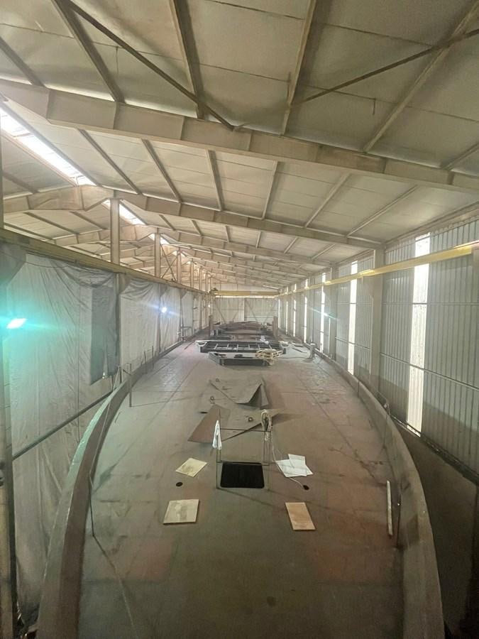 a large room with a car in it aboard MITI K Yacht for Sale