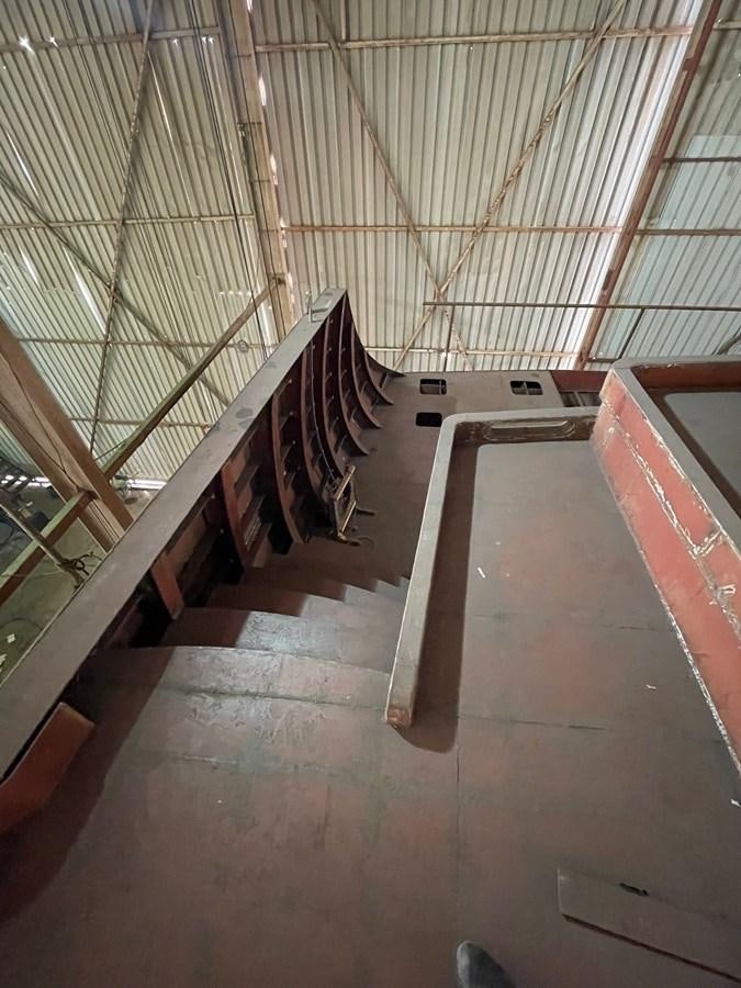 a large wooden staircase aboard MITI K Yacht for Sale