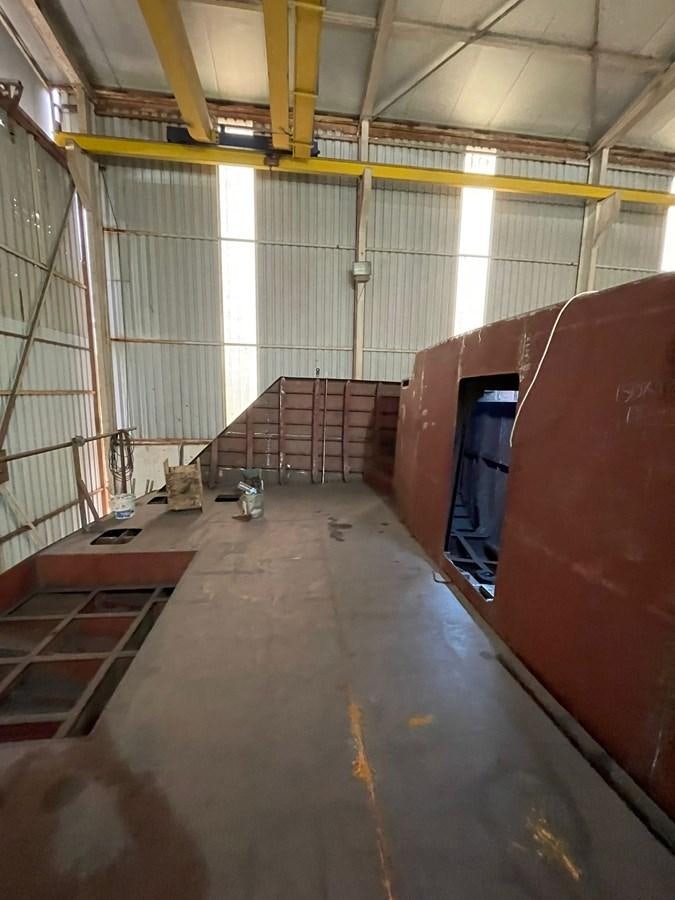 a room with a large wall aboard MITI K Yacht for Sale