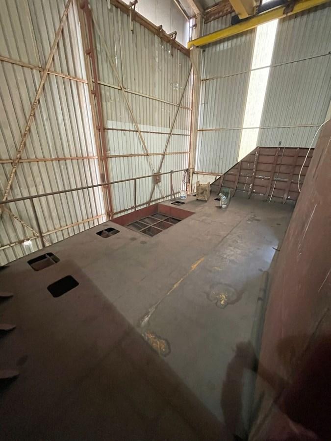 a room with a large metal cage aboard MITI K Yacht for Sale