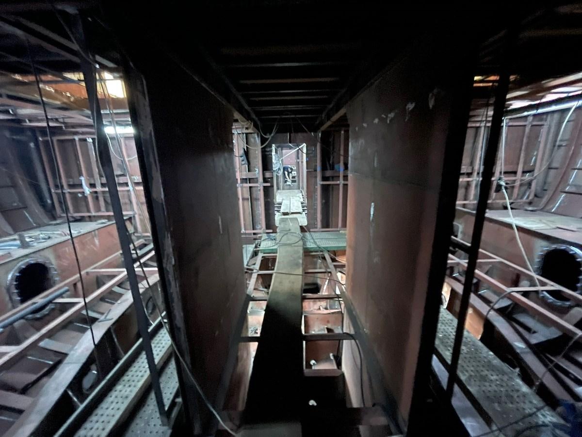 a large room with escalators aboard MITI K Yacht for Sale