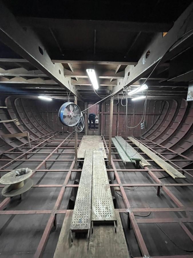 a large circular tunnel with a globe aboard MITI K Yacht for Sale