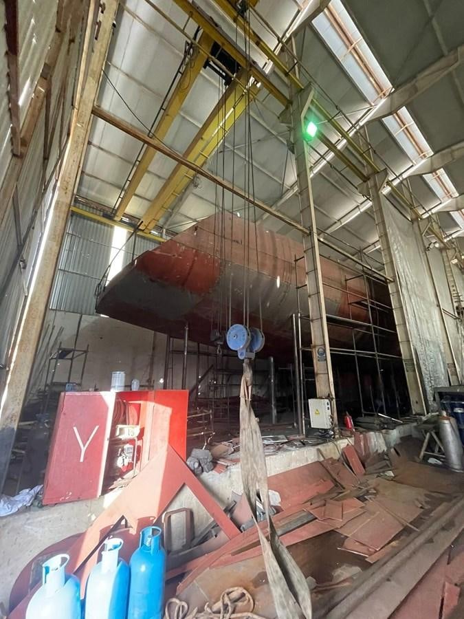 a large room with a few ladders and a few boxes aboard MITI K Yacht for Sale