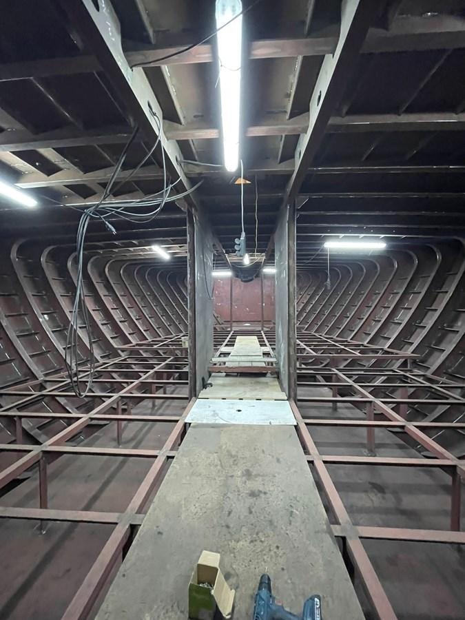 a large room with a staircase aboard MITI K Yacht for Sale