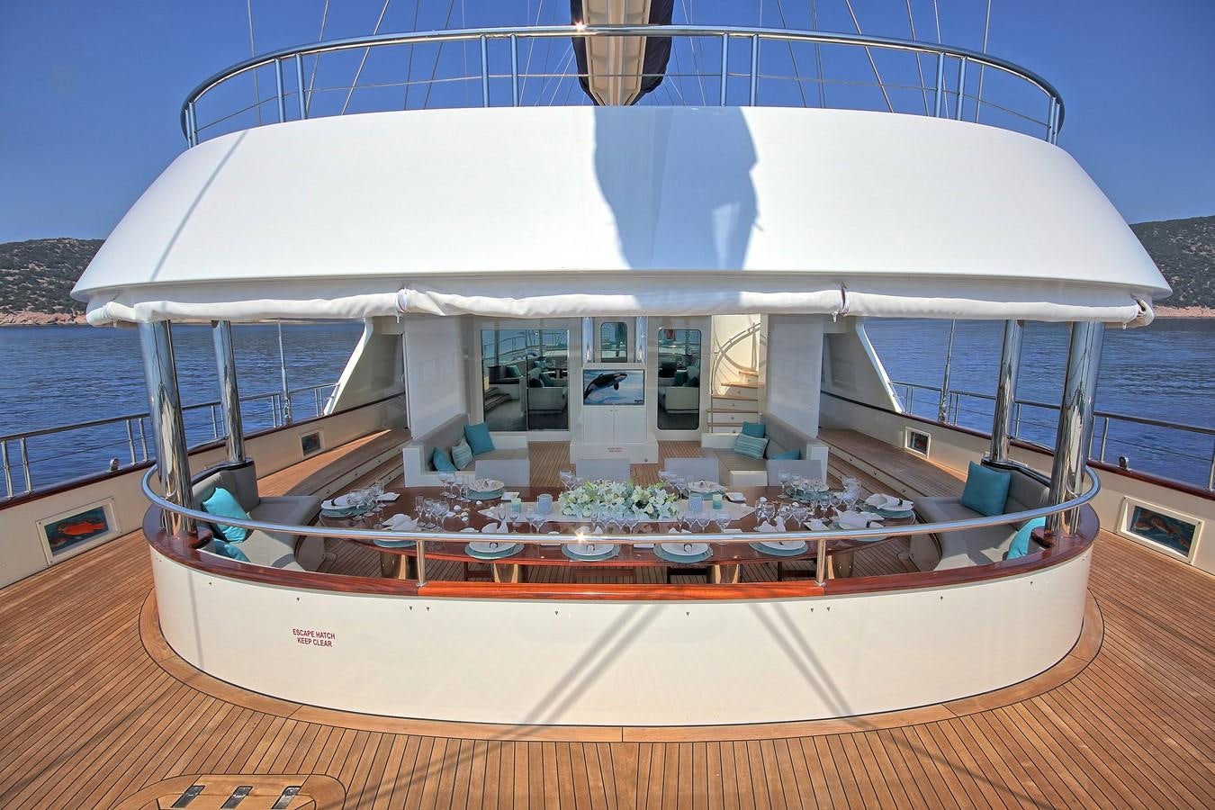 a large white boat on a deck aboard MEIRA Yacht for Sale
