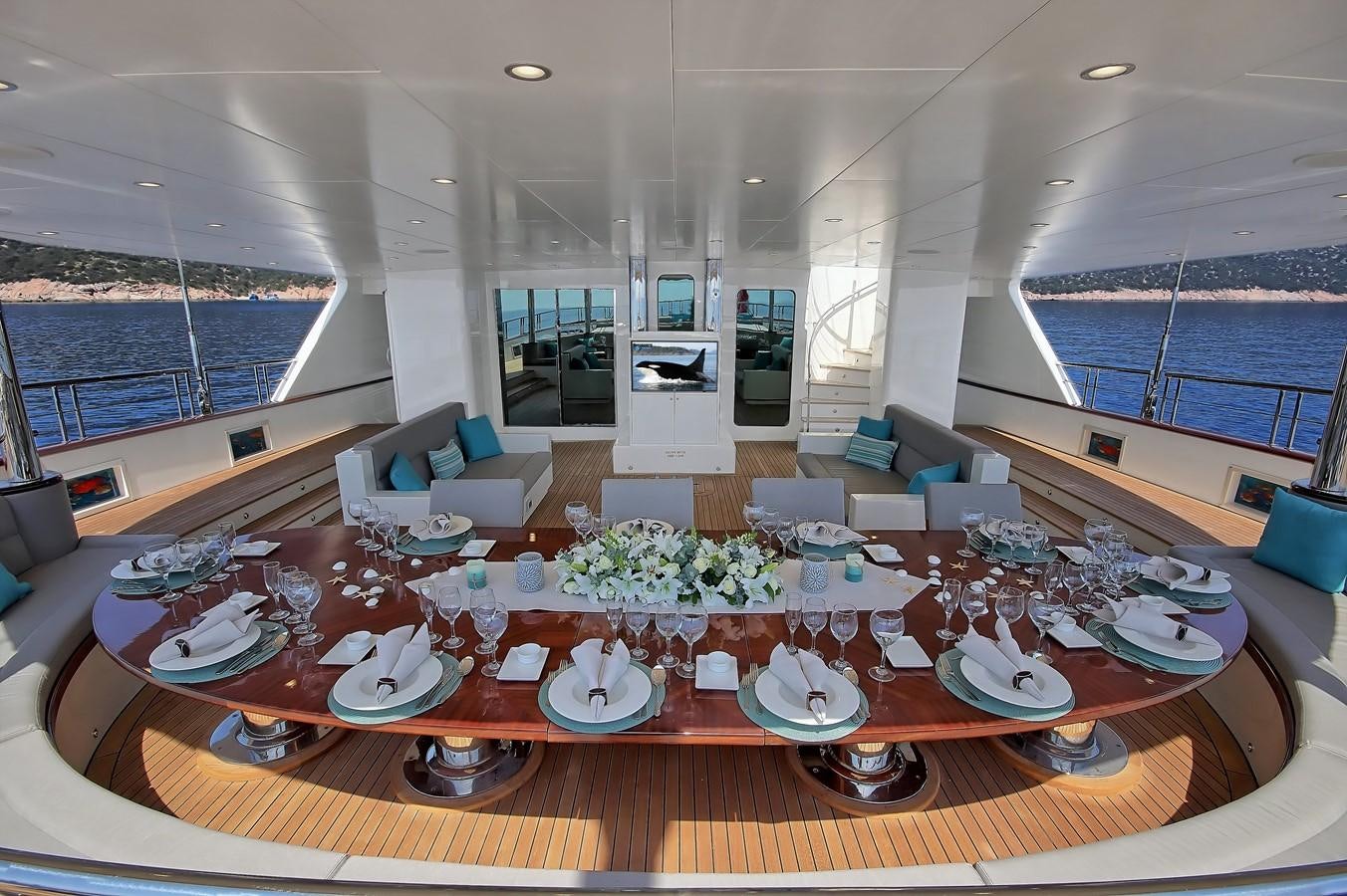 a room with a table and chairs aboard MEIRA Yacht for Sale
