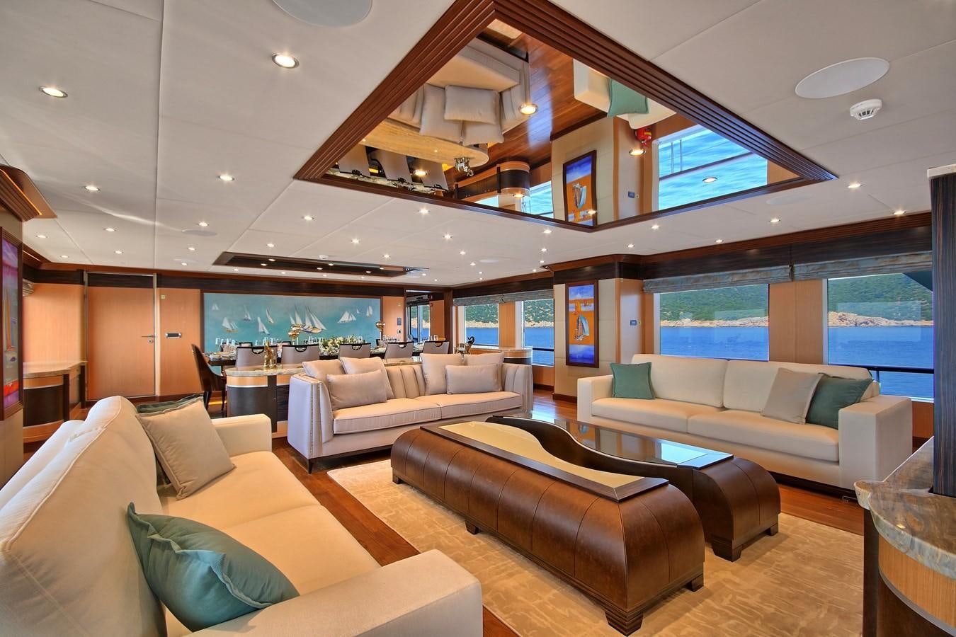 a living room with a large window aboard MEIRA Yacht for Sale