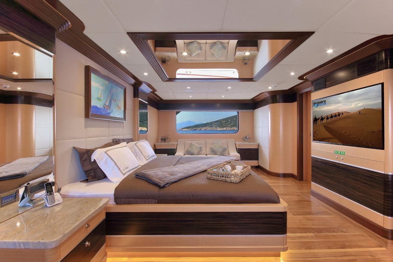 a bedroom with a large bed aboard MEIRA Yacht for Sale