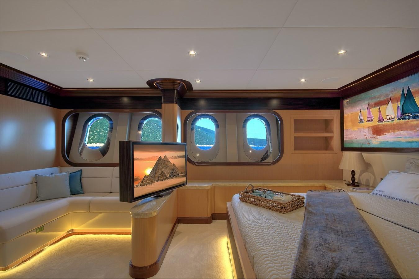 a room with a bed and a television aboard MEIRA Yacht for Sale