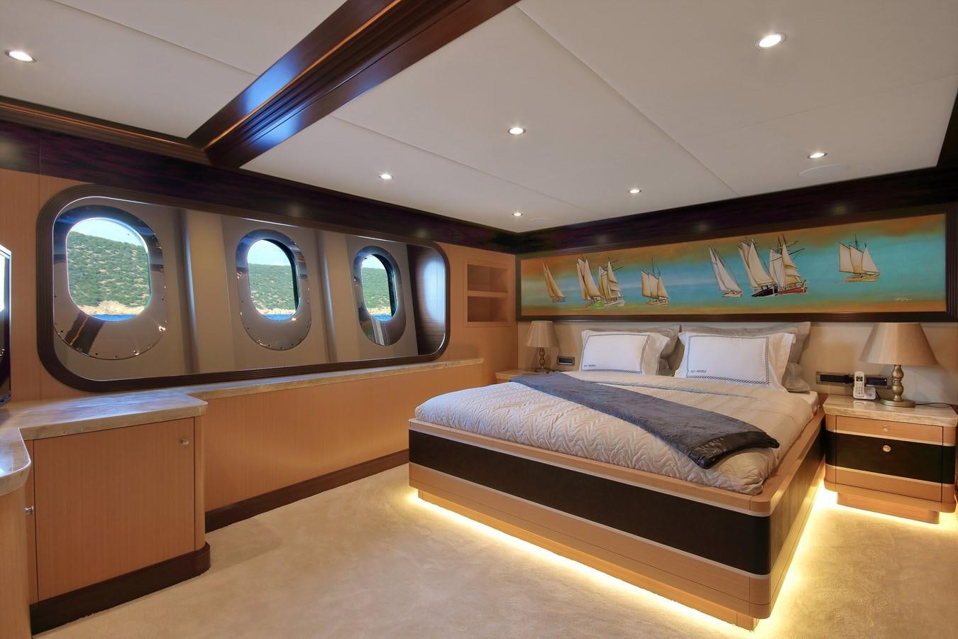 a room with a bed and a window aboard MEIRA Yacht for Sale