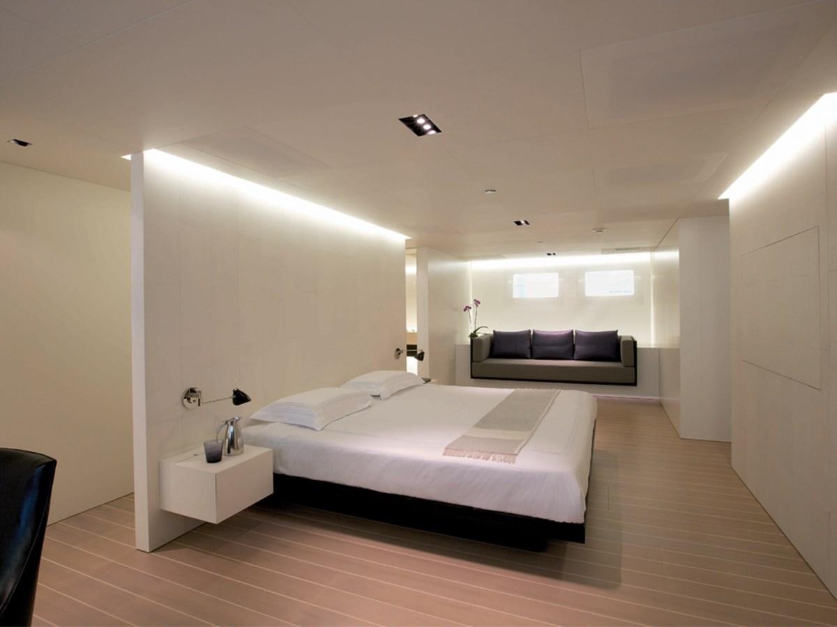 a bedroom with a bed and a couch aboard BARACUDA VALLETTA Yacht for Sale