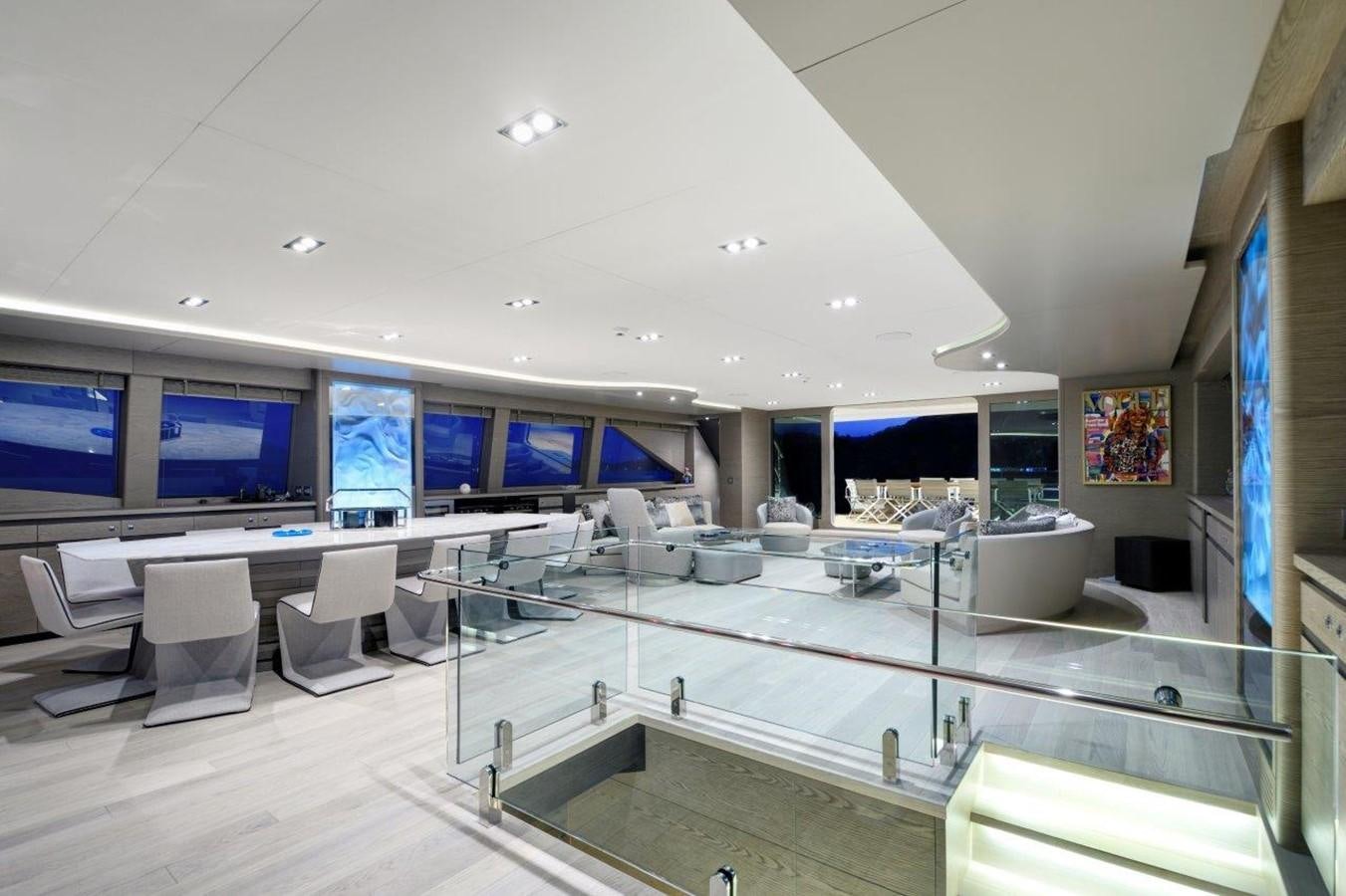 a large room with tables and chairs aboard ALL ABOUT U 2 Yacht for Sale