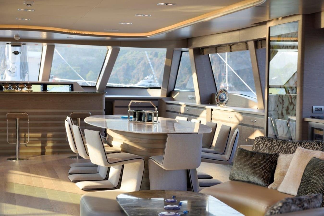 a room with a table and chairs aboard ALL ABOUT U 2 Yacht for Sale