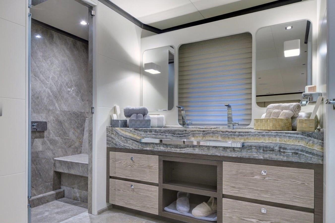 a bathroom with a large mirror aboard ALL ABOUT U 2 Yacht for Sale