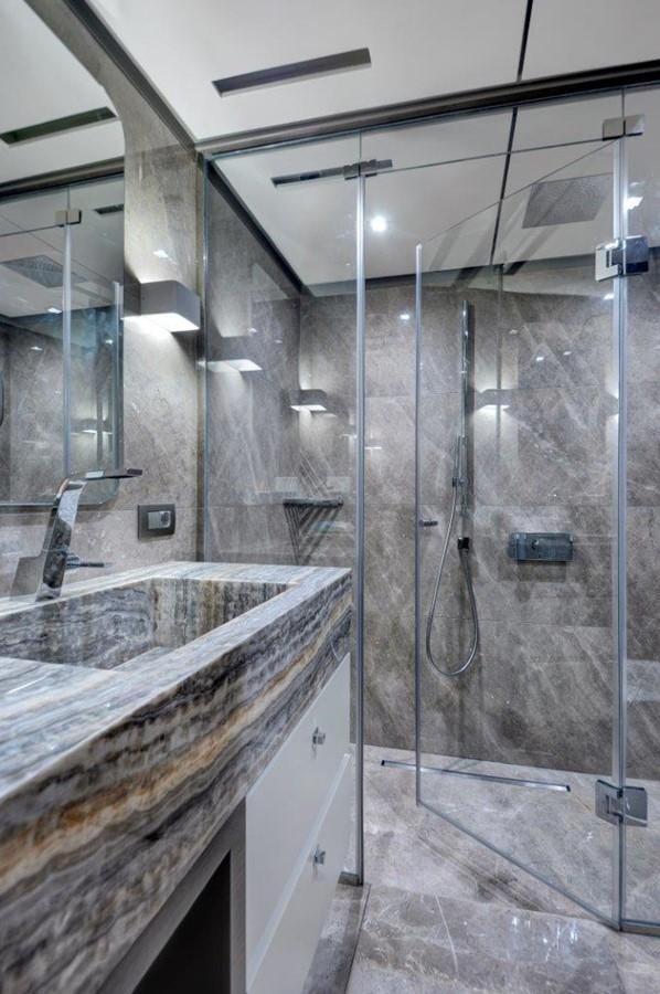 a bathroom with a glass shower aboard ALL ABOUT U 2 Yacht for Sale