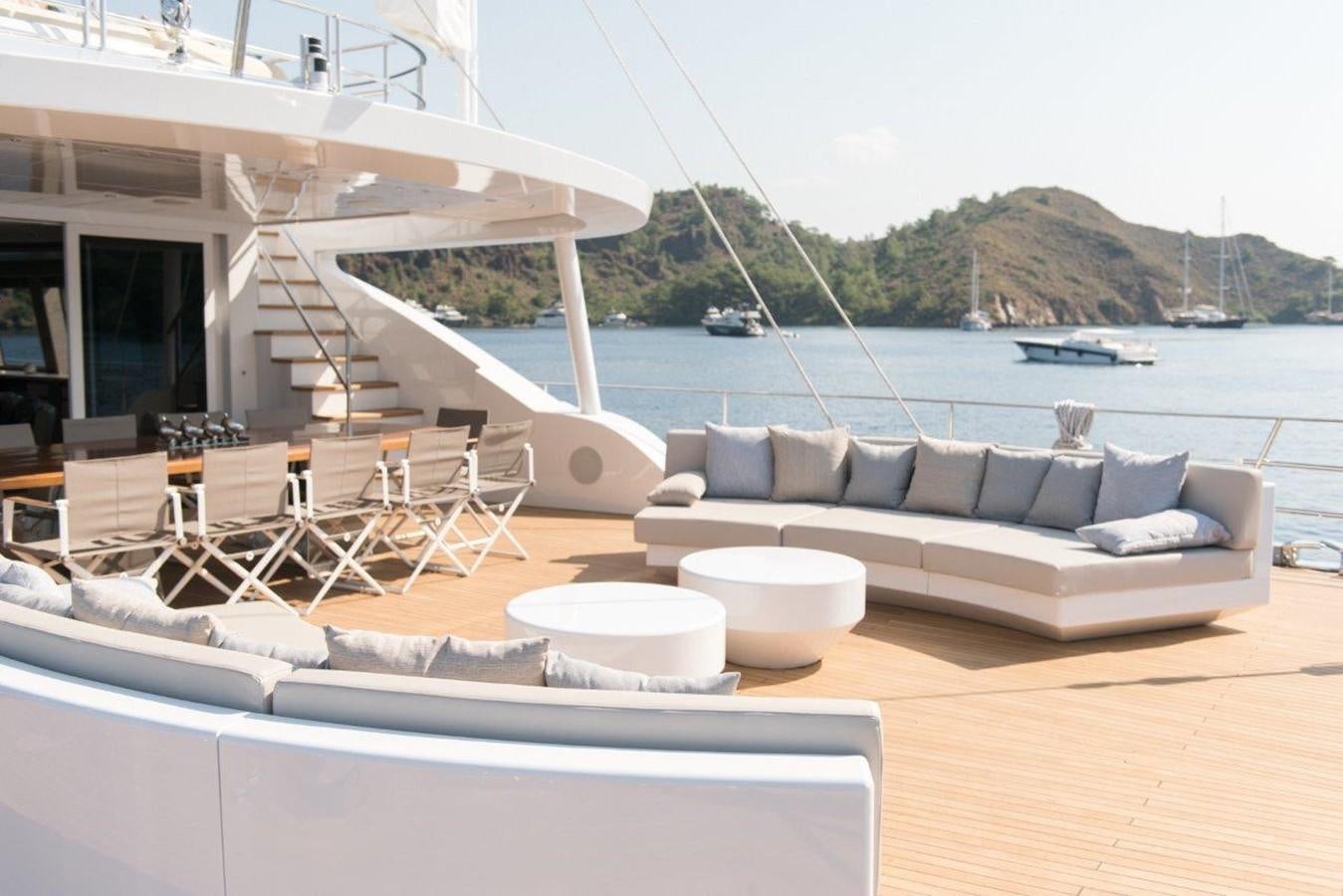 a couch and a table on a boat aboard ALL ABOUT U 2 Yacht for Sale