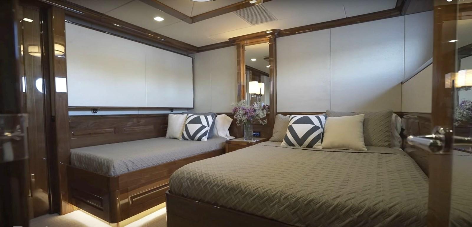 a room with two beds aboard JACKPOT Yacht for Sale