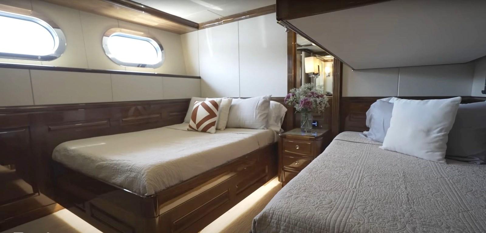 a room with two beds aboard JACKPOT Yacht for Sale