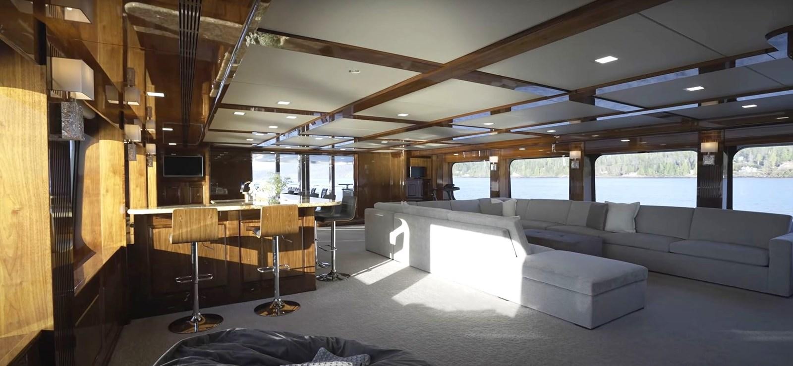 a room with a couch and a table aboard JACKPOT Yacht for Sale