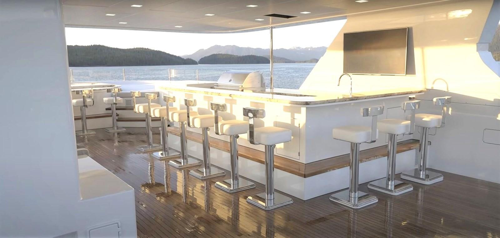 a room with tables and chairs aboard JACKPOT Yacht for Sale