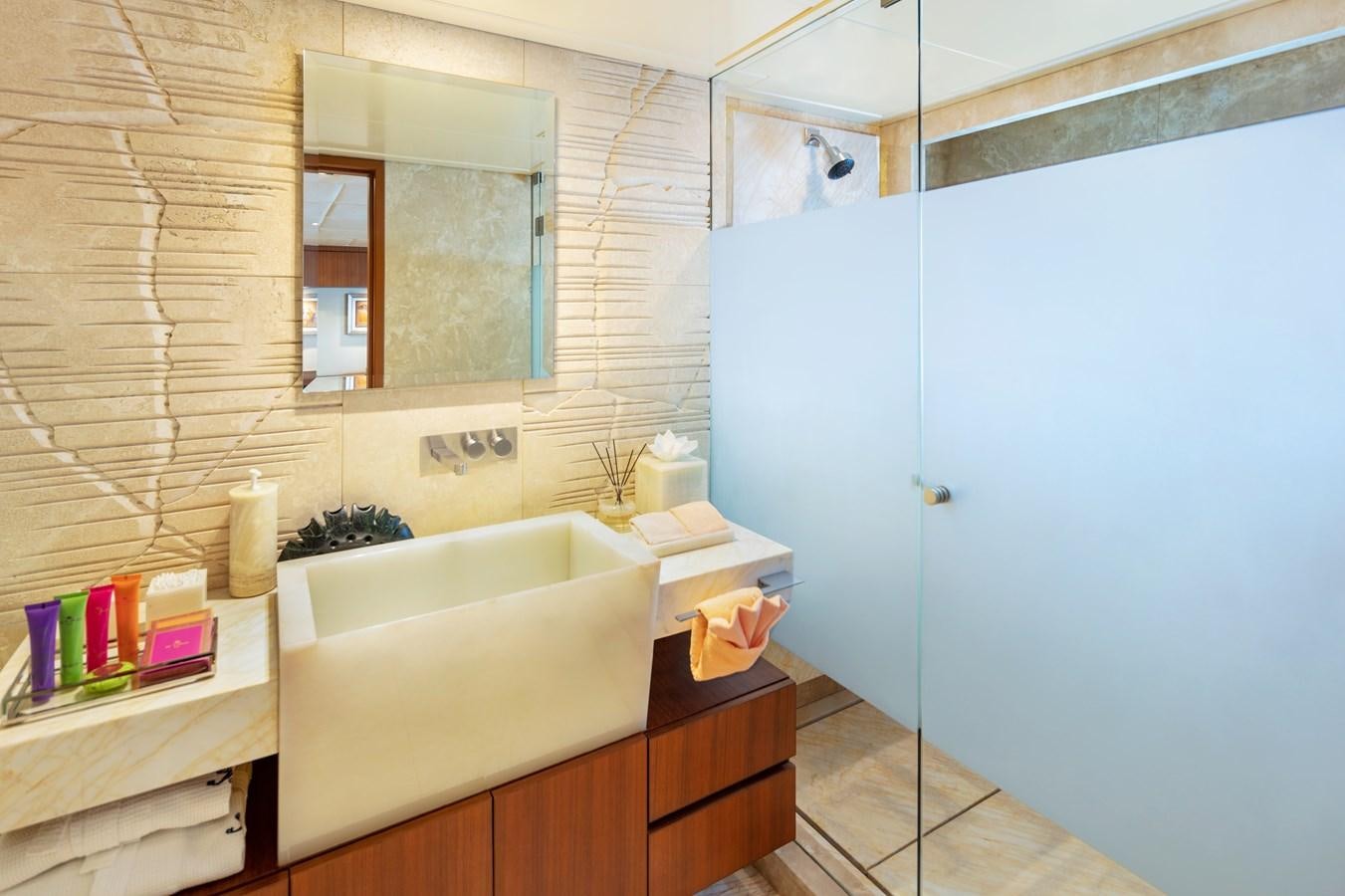 a bathroom with a bathtub and sink aboard CHAMPAGNE SEAS Yacht for Charter