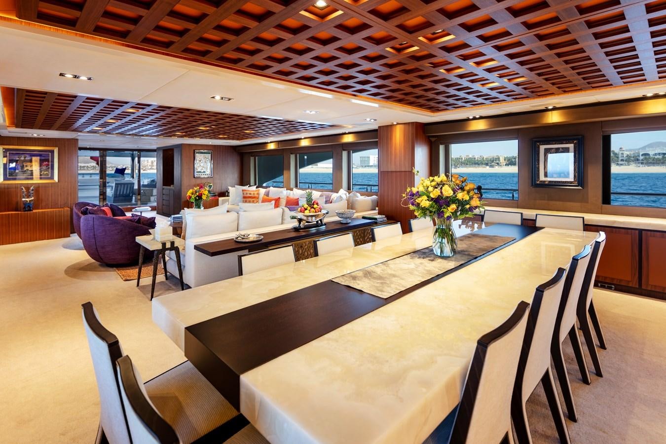 a large room with tables and chairs aboard CHAMPAGNE SEAS Yacht for Charter