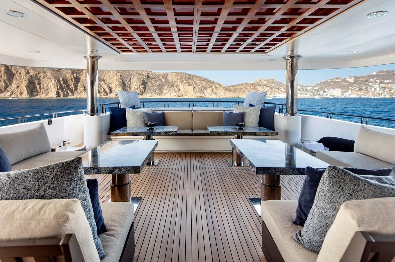 a boat with a deck and chairs aboard CHAMPAGNE SEAS Yacht for Charter