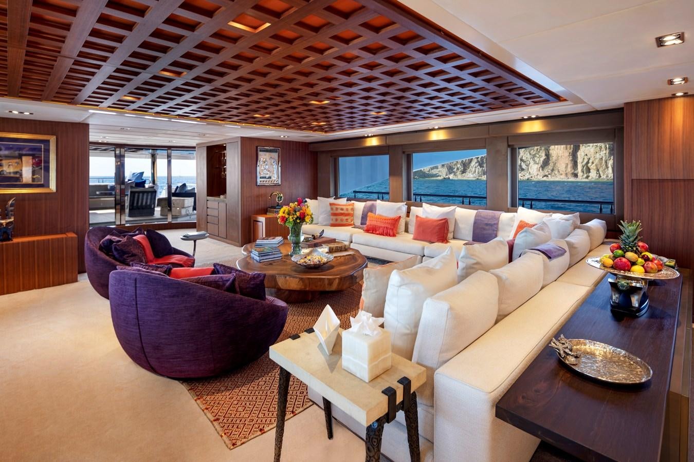 a living room with a large ceiling aboard CHAMPAGNE SEAS Yacht for Charter