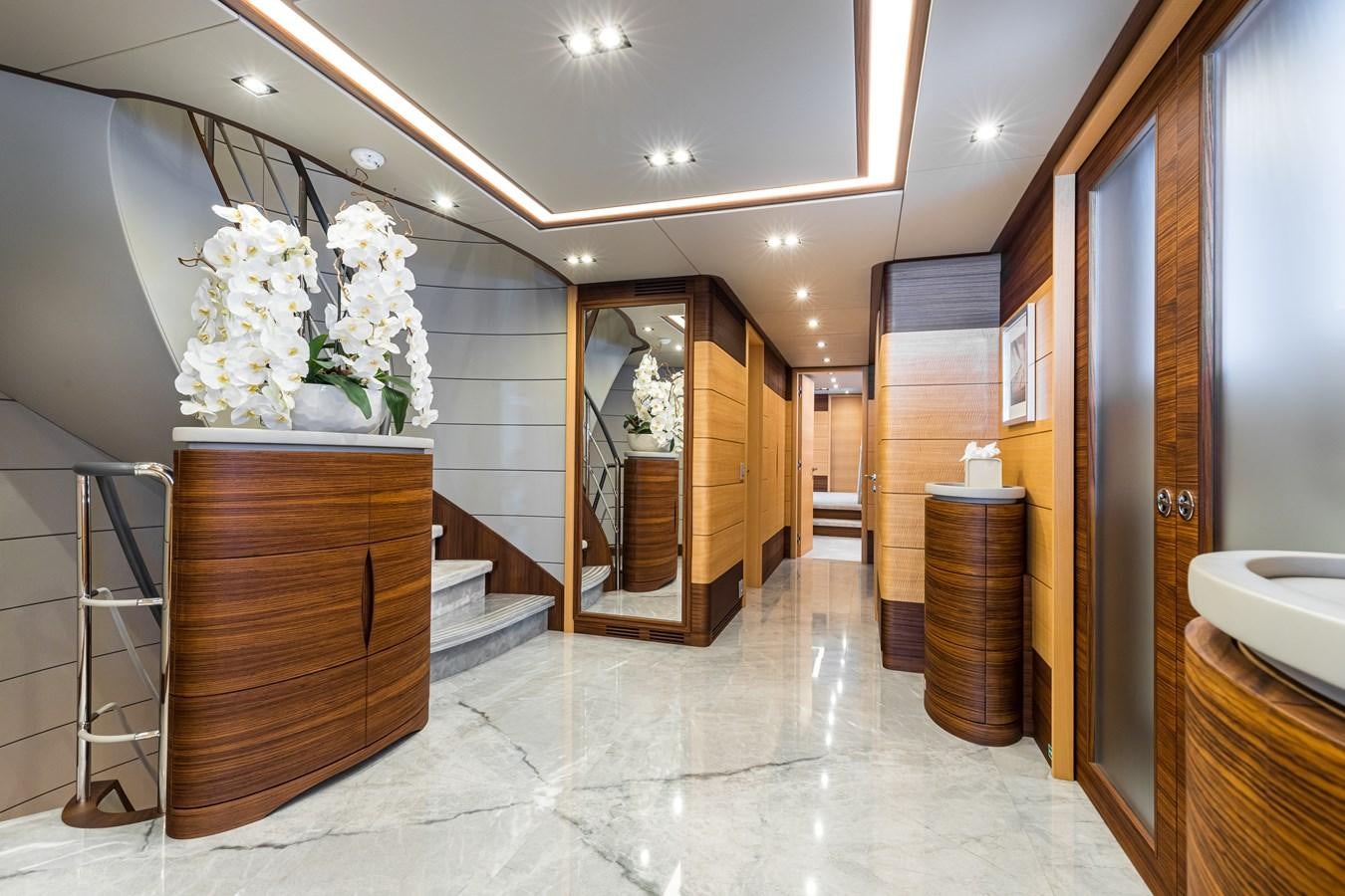 a bathroom with a marble floor aboard TRIUMPH Yacht for Charter