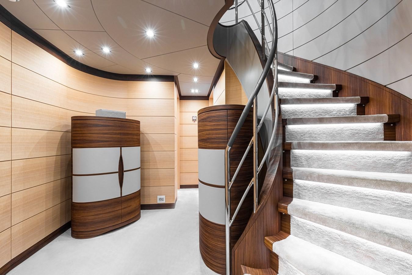 a staircase with a wood box aboard TRIUMPH Yacht for Charter
