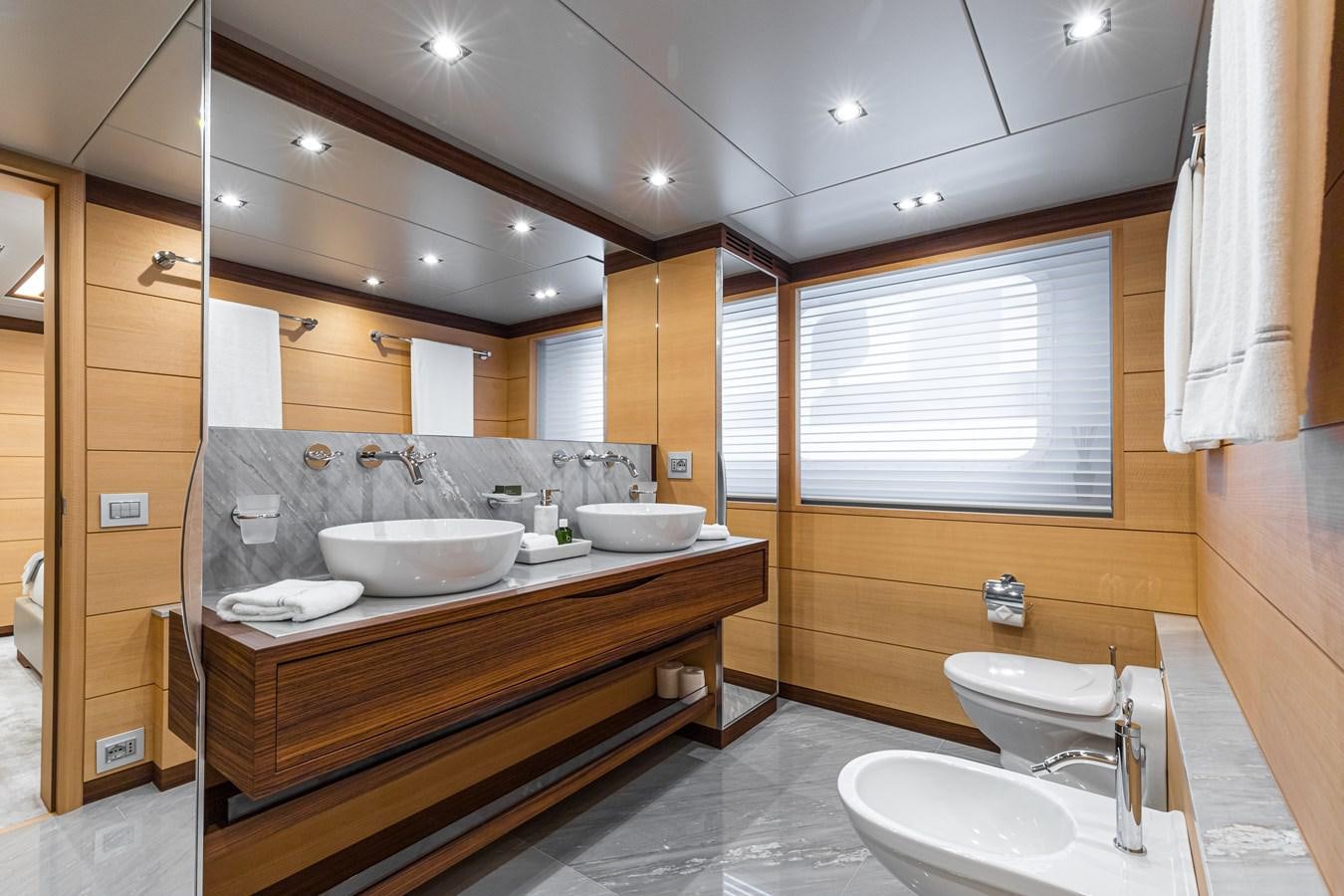 a bathroom with sinks and mirrors aboard TRIUMPH Yacht for Charter