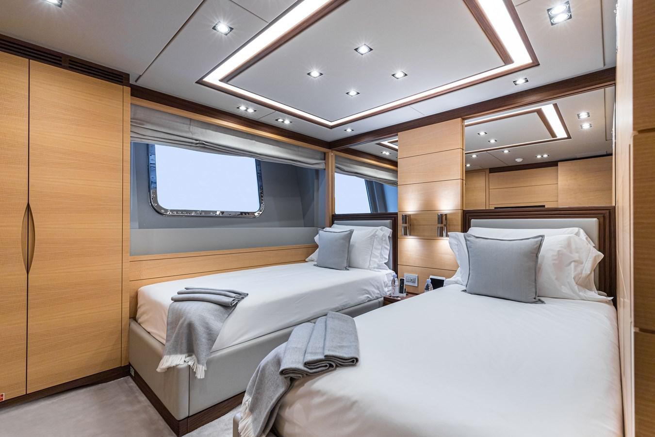 a room with two beds aboard TRIUMPH Yacht for Charter