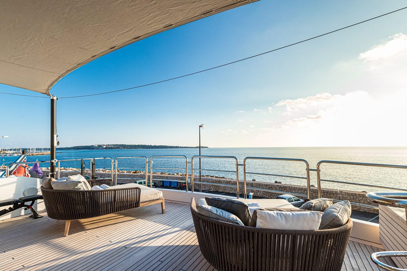a large balcony overlooking the ocean aboard TRIUMPH Yacht for Charter