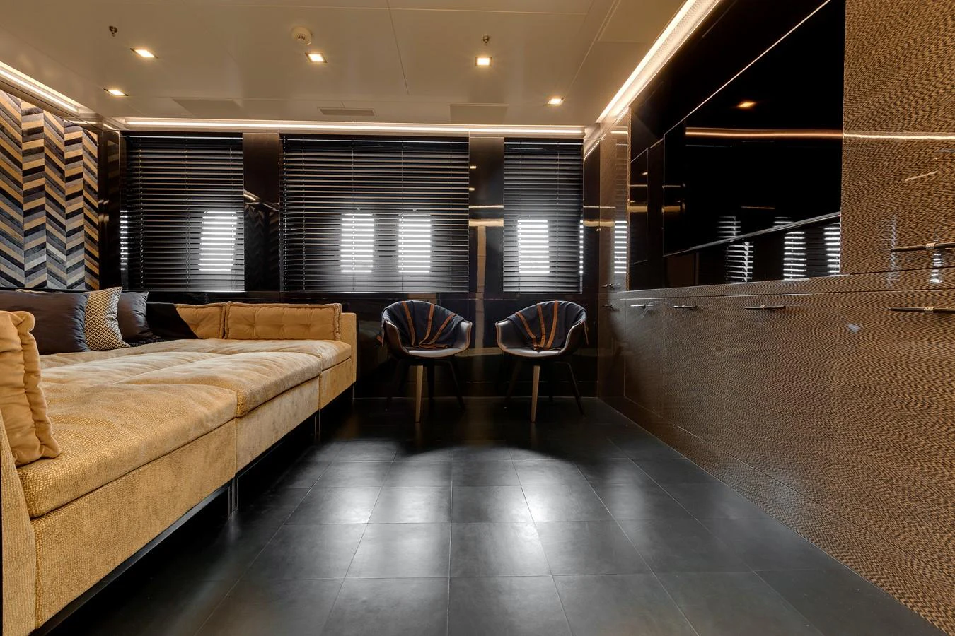 a living room with a couch and a table aboard APRICITY Yacht for Sale