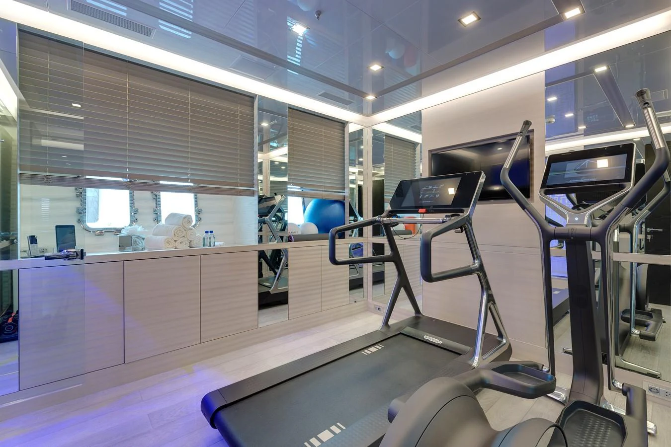 a gym with exercise equipment aboard APRICITY Yacht for Sale