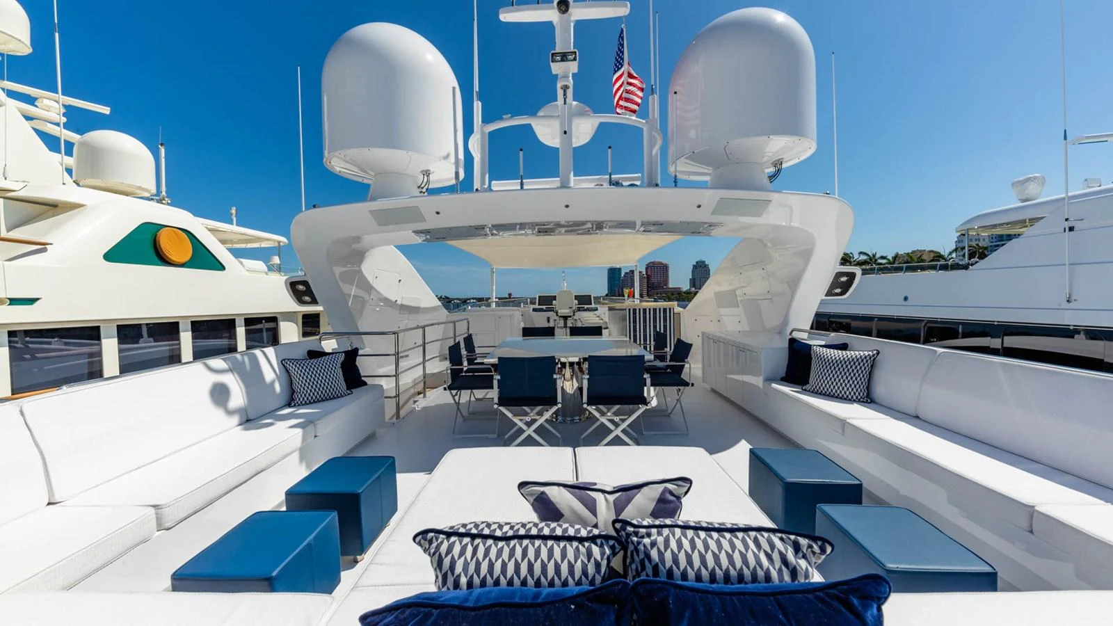 a large white ship with blue seats aboard APRICITY Yacht for Sale