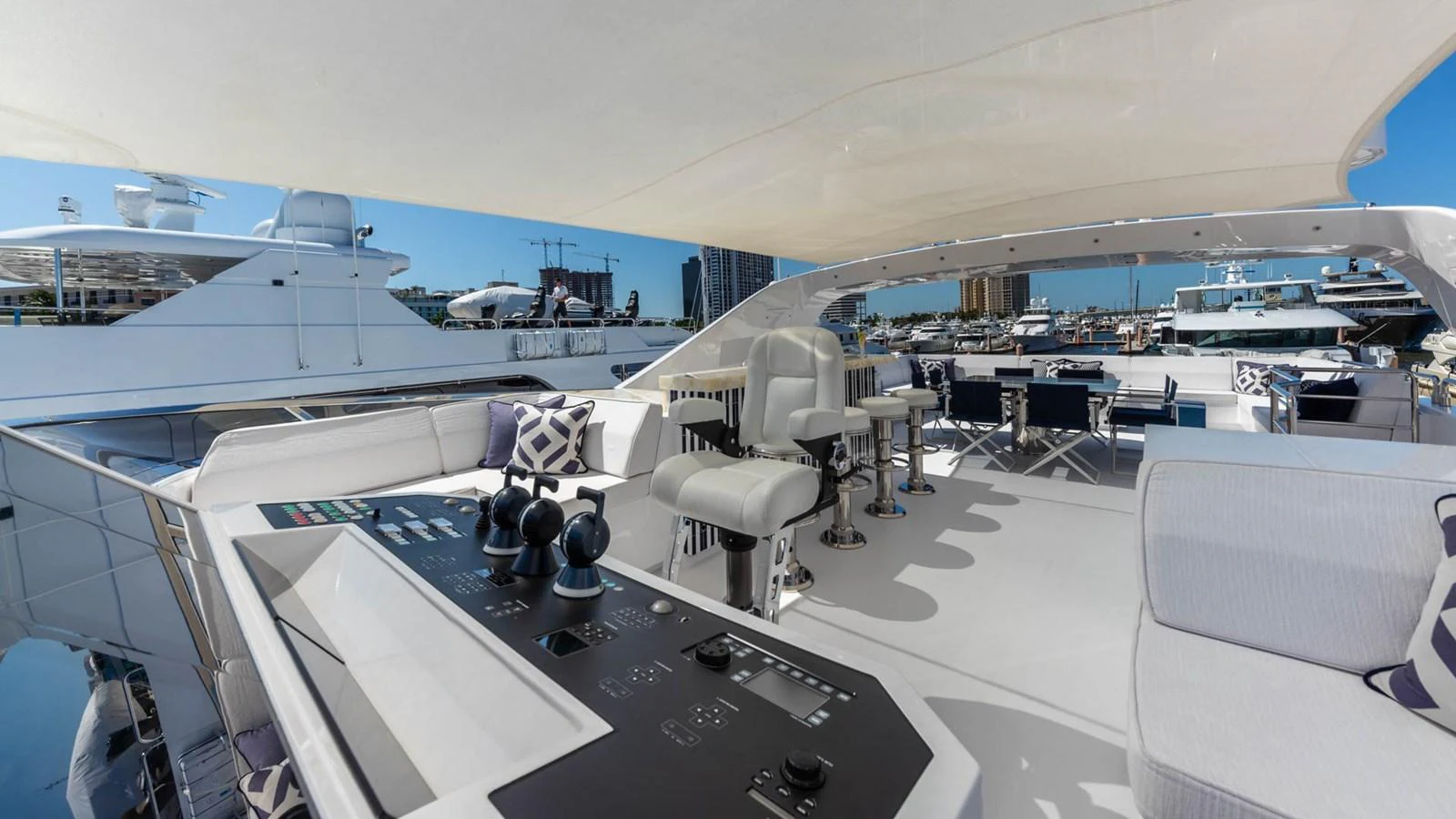 a room with a table and chairs aboard APRICITY Yacht for Sale