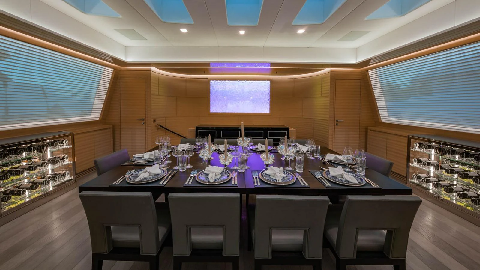 a dining room with a table set aboard APRICITY Yacht for Sale