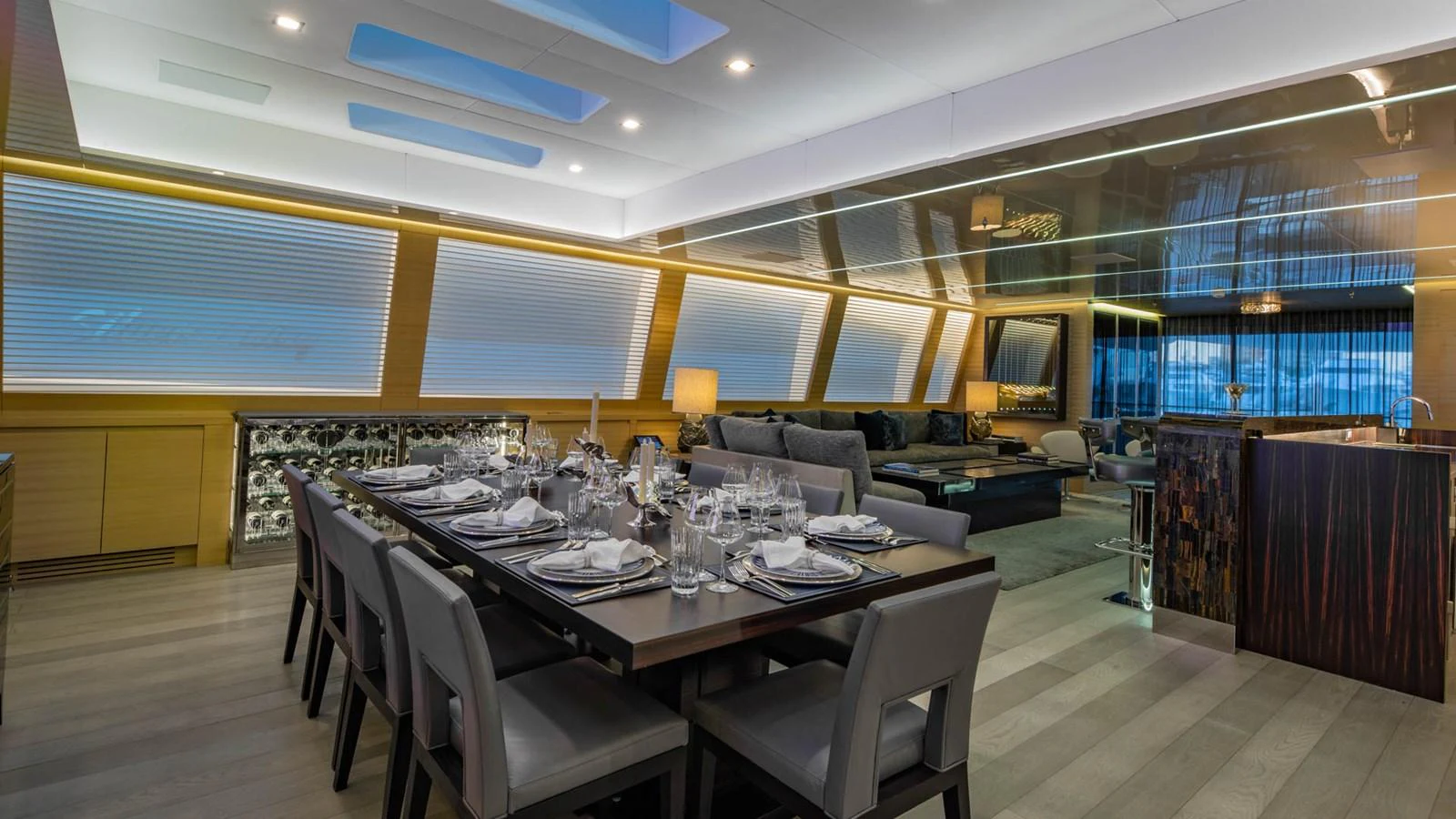 a large room with a table and chairs aboard APRICITY Yacht for Sale