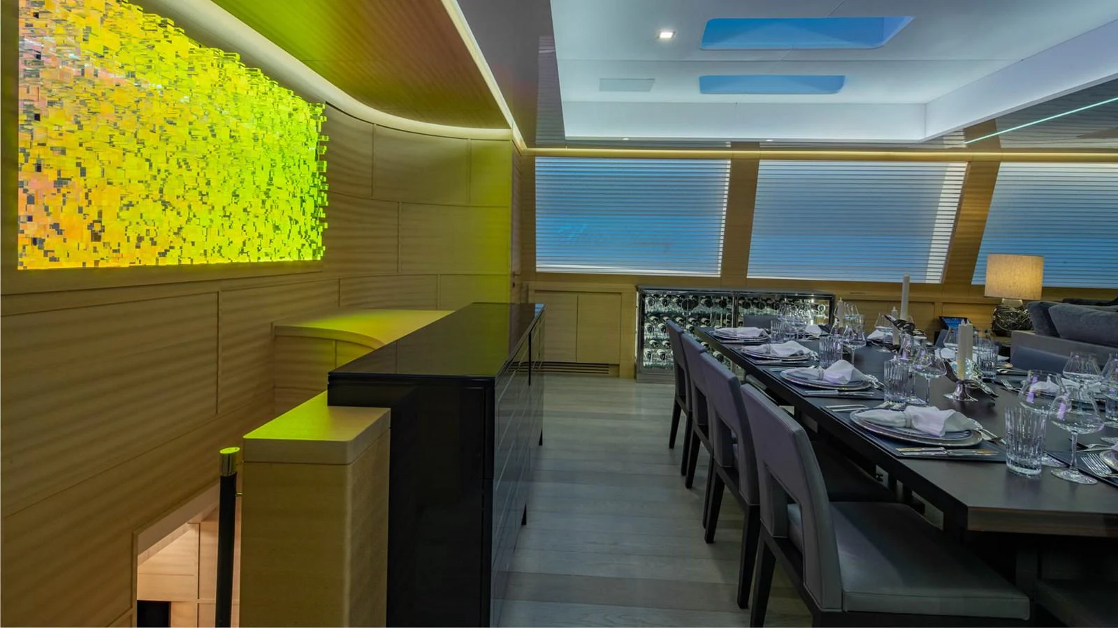 a room with tables and chairs aboard APRICITY Yacht for Sale