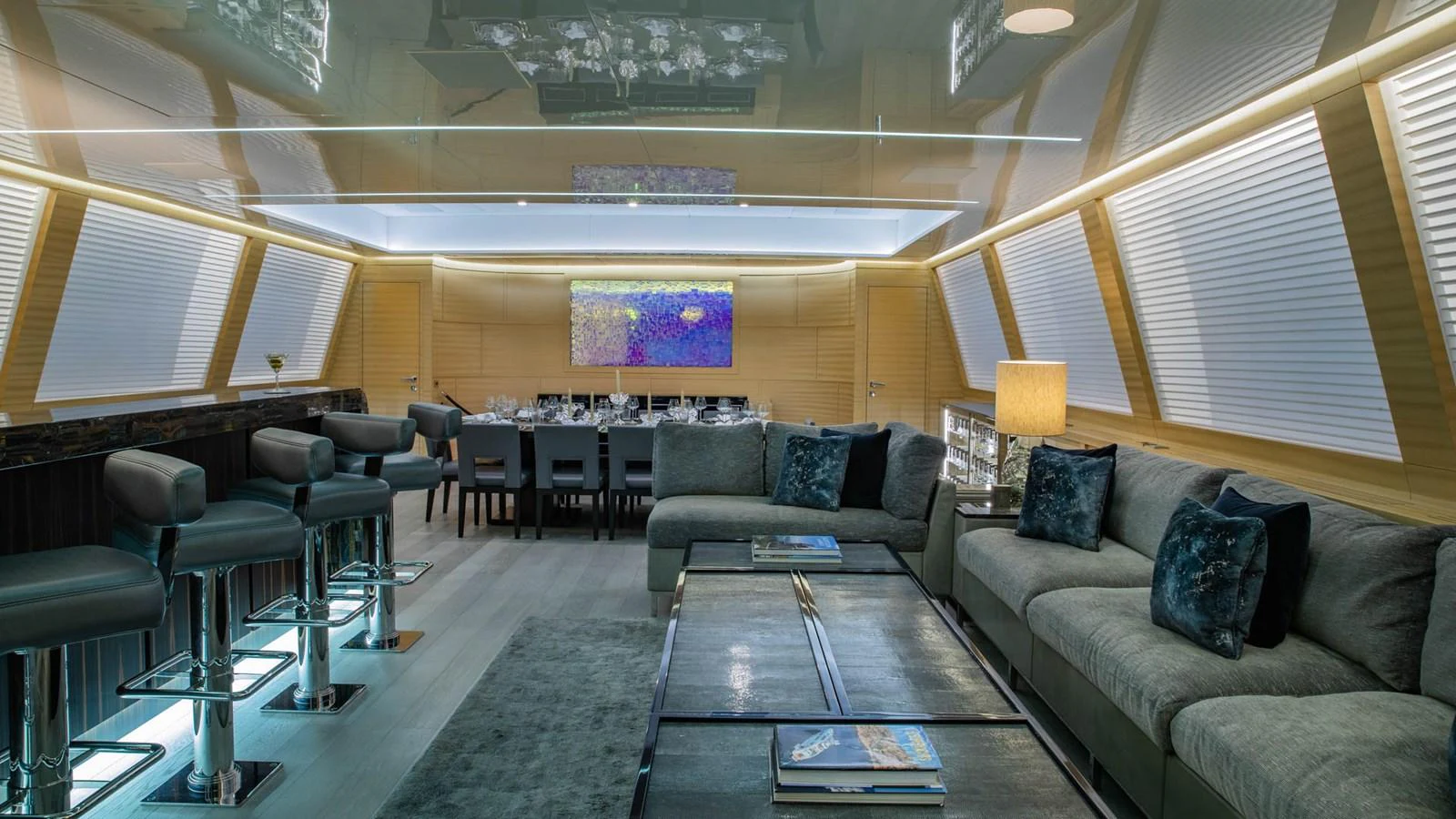 a large room with couches and a coffee table aboard APRICITY Yacht for Sale