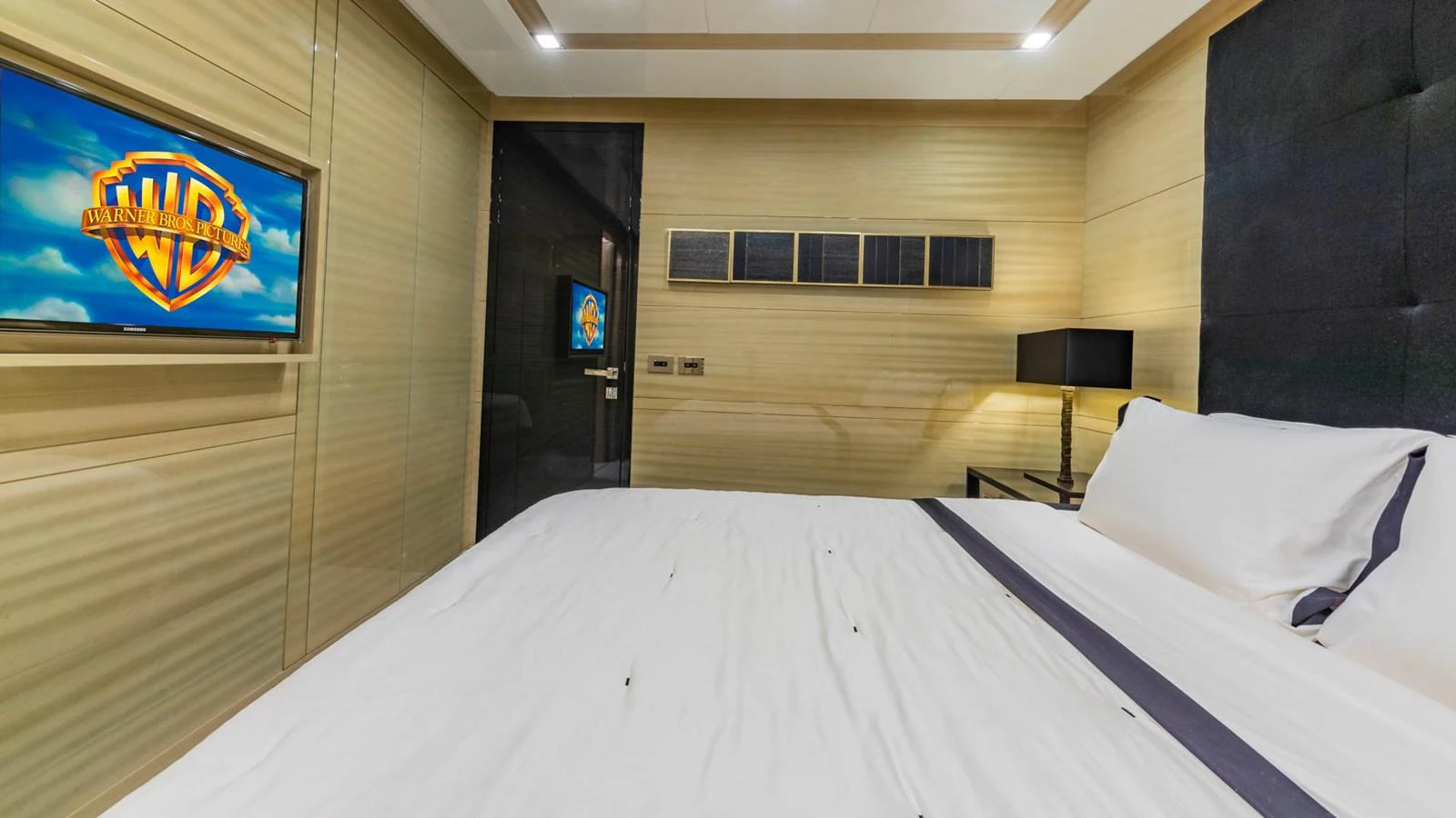 a hotel room with a bed aboard APRICITY Yacht for Sale