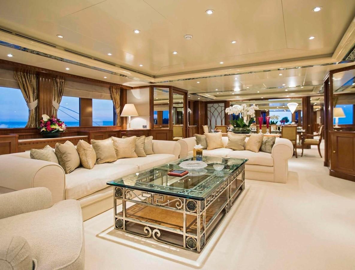 a living room with a large sofa aboard COME PRIMA Yacht for Charter