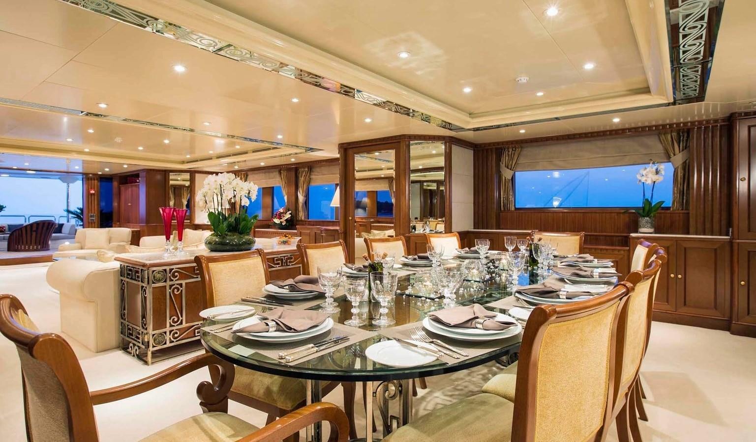 a large dining room with a large table and chairs aboard COME PRIMA Yacht for Charter