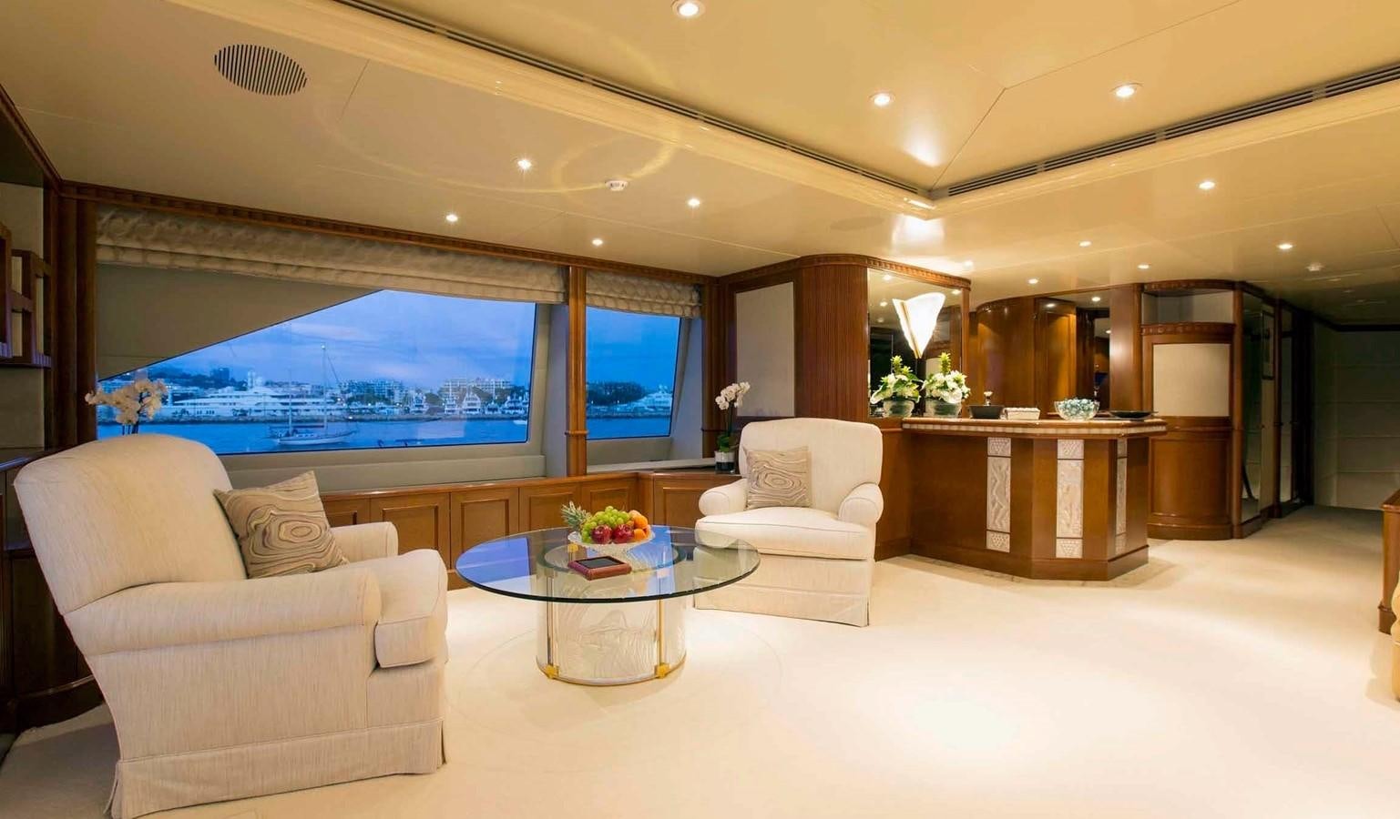 a living room with a large screen aboard COME PRIMA Yacht for Charter